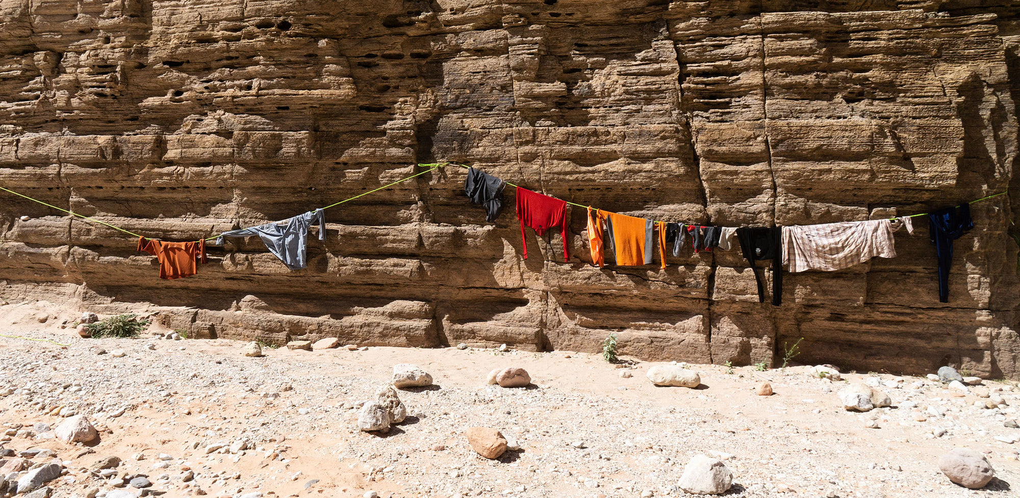 Clothes drying on a line in the desert.