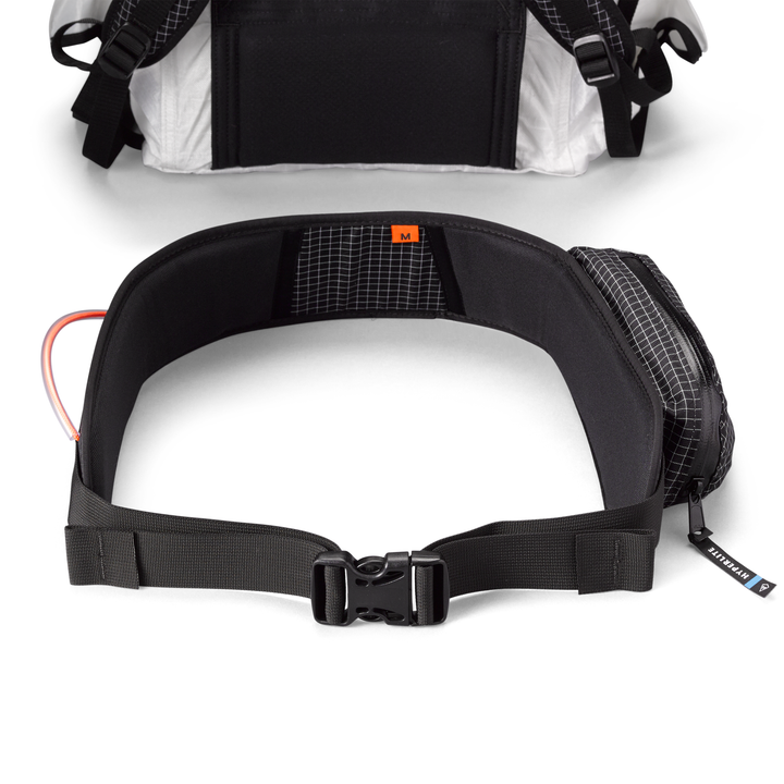 A black and white waist pack with two straps.