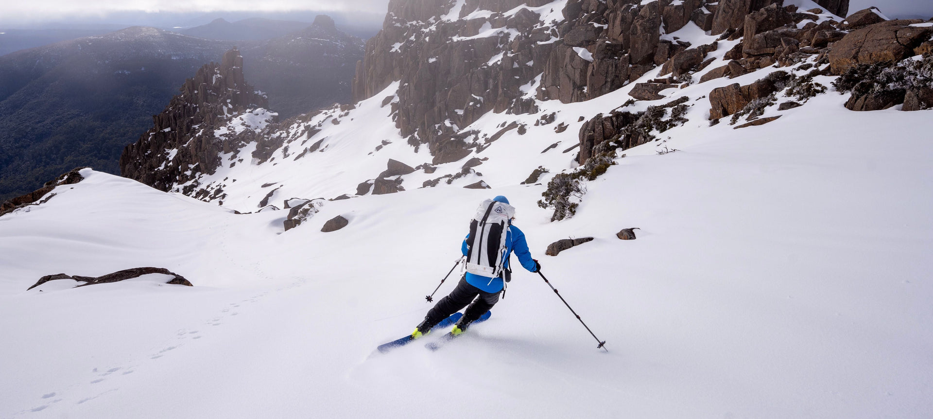 A person is skiing down a mountain.