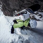 Skiier Cody Townsend ascends a steep slope wearing the Hyperlite Mountain Gear Crux 40