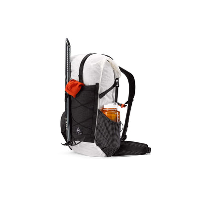 Front view of the Hyperlite Mountain Gear Elevate 22 with an ice tool and water bottle attached