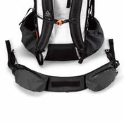 Rear view of the Hyperlite Mountain Gear Unbound 55 showing the removable hip belt disconnected from the pack