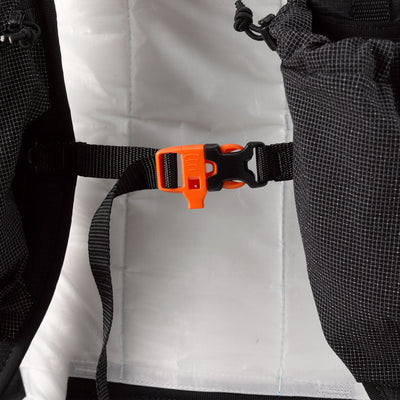 Close up of the 5/8" sternum strap attached to the shoulder straps of the Hyperlite Mountain Gear Waypoint 35