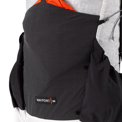 Gear stashed in the Dyneema® Stretch Mesh center pocket on the Hyperlite Mountain Gear Waypoint 35