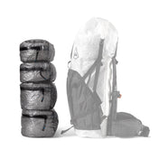 Four different sizes of the Hyperlite Mountain Gear Pods stacked next to a large pack for a size comparison