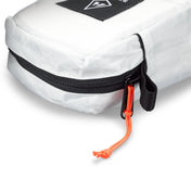Detail shot of exterior zipper of Hyperlite Mountain Gear's Prism Crampon Bag in White