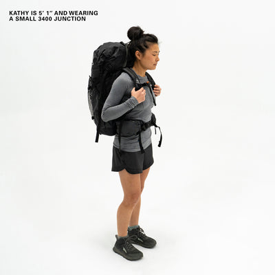 Front View of a model wearing the Hyperlite Mountain Gear Junction 40 in Black showcasing the Dyneema® hip belt and shoulder straps