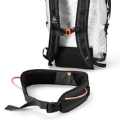 Shot of the removable hip belt with gear loops and ice clipper slots in front of Hyperlite Mountain Gear's Ice Pack 55 Pack