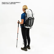 Right side view of Hyperlite Mountain Gear's Junction 55 Pack in White on model with poles