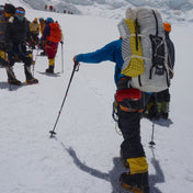 Hiker wearing Hyperlite Mountain Gear's Ice Pack 70 in the snowy mountains