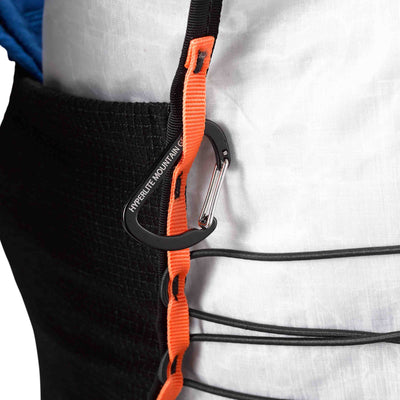 Side view of the Hyperlite Mountain Gear Unbound 40 with a carabiner attached to one of four 1/4" vertical daisy chains