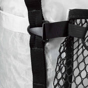 Detail shot of Hyperlite Mountain Gear's Porter Stuff Pocket's Buckle attached to a Pack's Strap