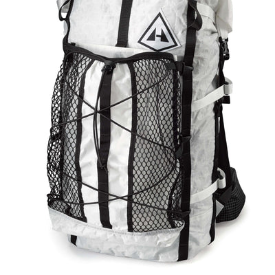 Front view of Hyperlite Mountain Gear's Porter Stuff Pocket in Black attached to a White Pack