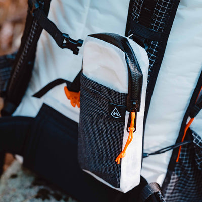 Hyperlite Mountain Gear's Shoulder Pocket in White on a Backpack Strap