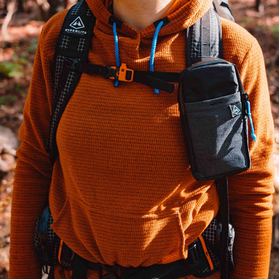 Front view of Hyperlite Mountain Gear's Shoulder Pocket in Black on hiker
