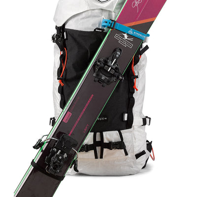 Front view of the Hyperlite Mountain Gear Diagonal Carry Kit holding a set of skis