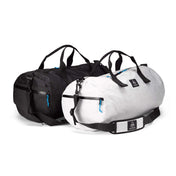 A front view two Hyperlite Mountain Gear 30L Approach Duffels in both Black and White