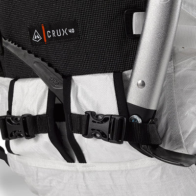 Close up view of the dual Ice Axe Pick Pockets with 3/4" buckles and reflective bungees on the Hyperlite Mountain Gear Crux 40