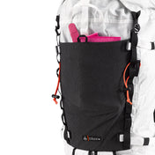 Front view of the Hyperlite Mountain Gear Crux 40 with gear stashed in the Dyneema® Stretch Mesh UL front pocket