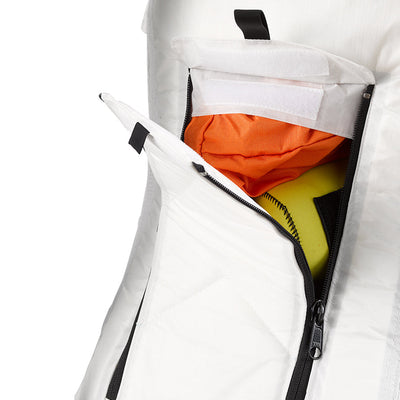 View showing the #8 YKK zipper avalanche pocket half unzipped for easy access to gear on the slopes, on the Hyperlite Mountain Gear Crux 40