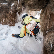 Skiier Cody Townsend descends a steep couloir wearing the Hyperlite Mountain Gear Crux 40