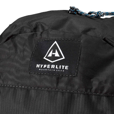 Detail shot of the Hyperlite Mountain Gear Logo on the Daybreak 17 Pack in Black