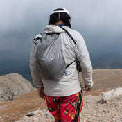 Hiker wearing Hyperlite Mountain Gear's Stuff Pack 30 on mountain top