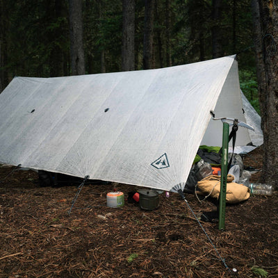 Hyperlite Mountain Gear's Flat Tarp in White setup in the woods