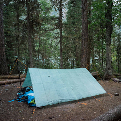 Hyperlite Mountain Gear's Flat Tarp in Spruce Green setup in the woods