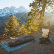 Camper sleeping on Hyperlite Mountain Gear's Ground Cloth on mountain