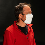 Right side view of Hyperlite Mountain Gear's Face Mask in White on model