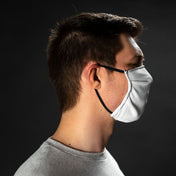 Right side view of Hyperlite Mountain Gear's Face Mask in White on model