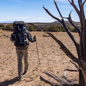 Hiker wearing Hyperlite Mountain Gear's Porter Stuff Pocket in the Desert