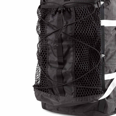 Detail shot of Hyperlite Mountain Gear's Black Porter Stuff Pocket attached to a Black Pack