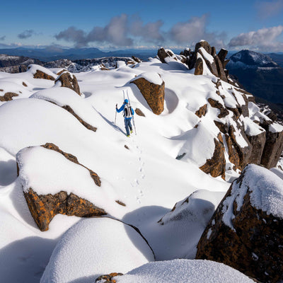 Skiiers reach the snowy summit with their Hyperlite Mountain Gear Headwall 55's