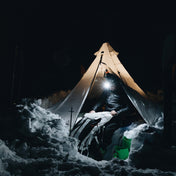 Night camping with a headlamp while retrieving gear from the Headwall 55