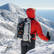 Hyperlite Mountain Gear's Ice Pack 40 in White on the snowy mountains