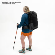 Angled view of a 5'6" Model wearing the Hyperlite Mountain Gear Unbound 40 Pack in Black, Medium