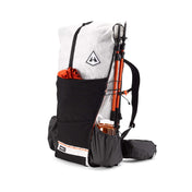 Front view of the Hyperlite Mountain Gear Unbound 55 with gear stashed in the dual entry mesh front pocket made of Dyneema® stretch mesh