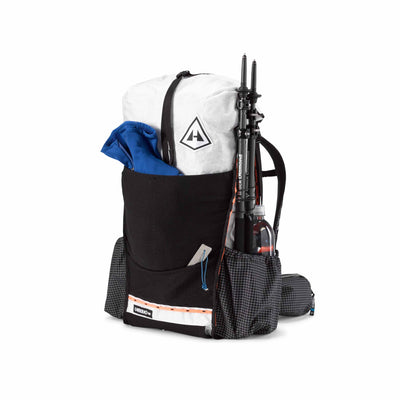 Front view of the Hyperlite Mountain Gear Unbound 40 in White with gear stashed in the durable Dyneema® Stretch Mesh front pocket and side pockets