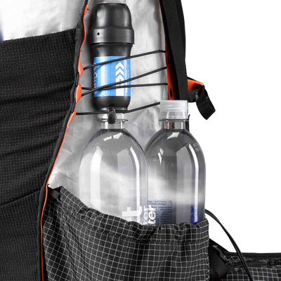 Two water bottles comfortably nestled in the hardline with Dyneema® side pockets of the Hyperlite Mountain Gear Unbound 40 Pack
